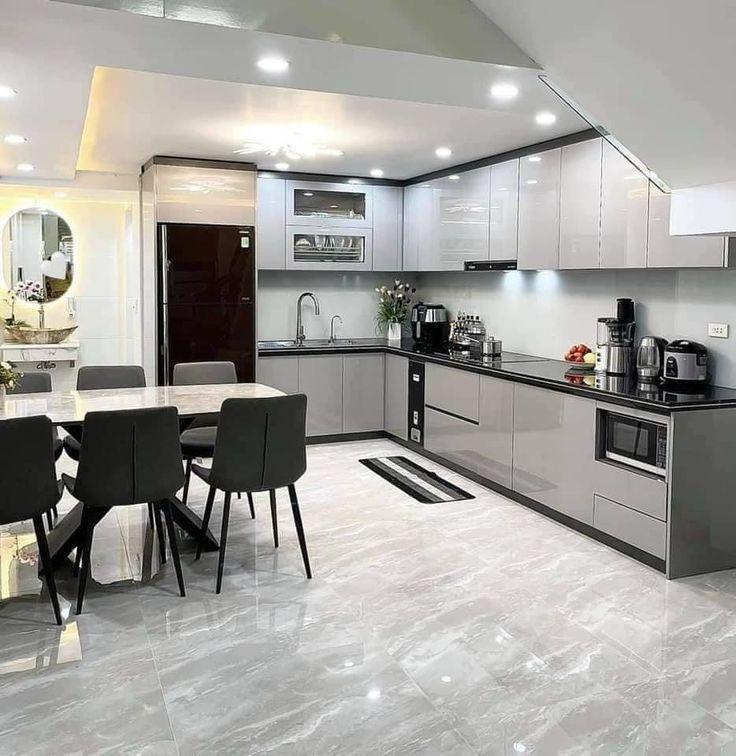 Mẫu Tủ bếp chữ L cho chung cư nhỏ (bếp 5–8m²) Tủ bếp chữ L tông trắng hiện đại